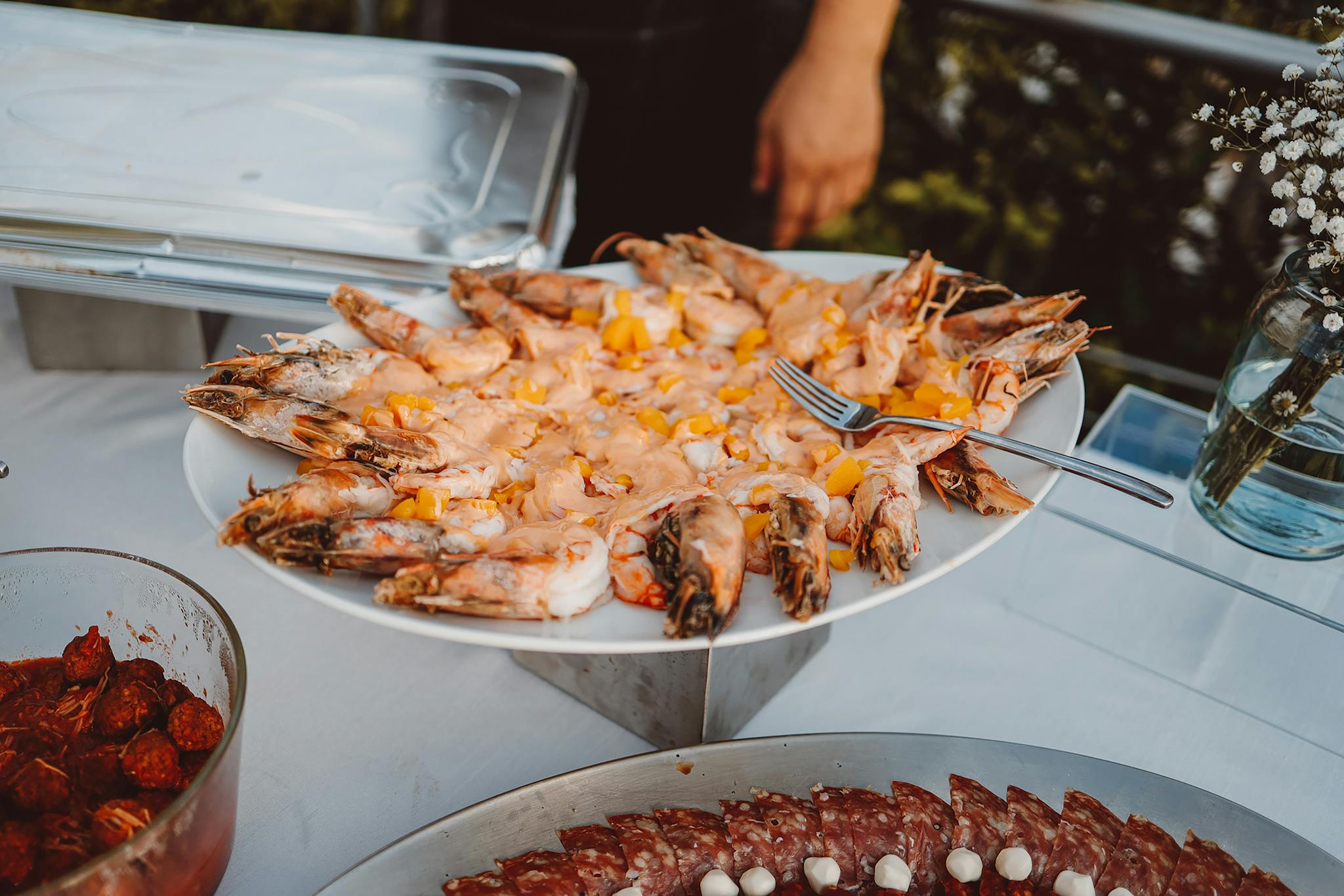 Delicious seafood platter with shrimp and mango served on a buffet table.