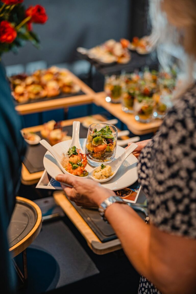 Elegant presentation of gourmet finger food during a luxurious indoor dining event.